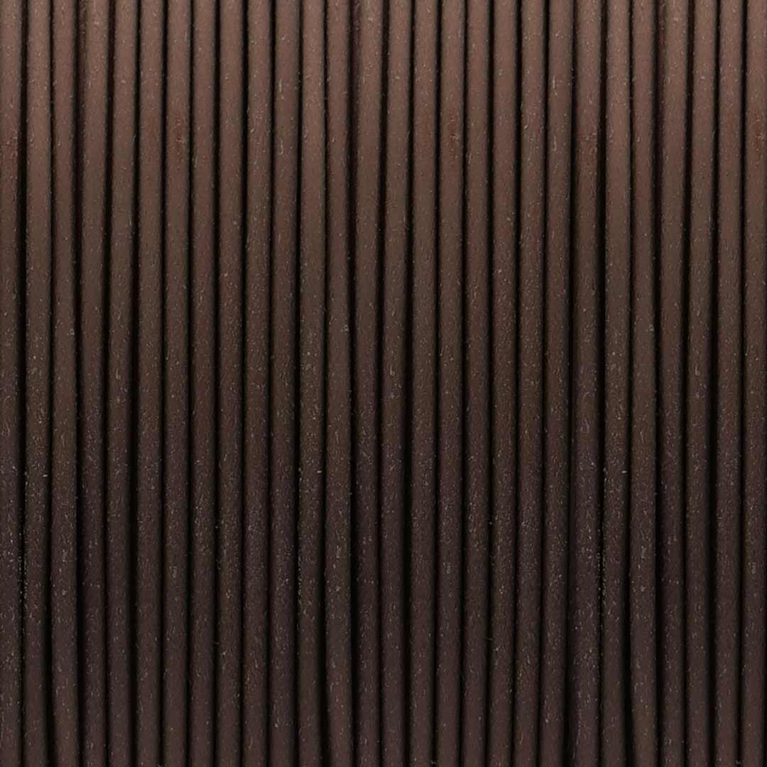 Macro view of Dark Bronze Interference PLA filament showing metallic grain