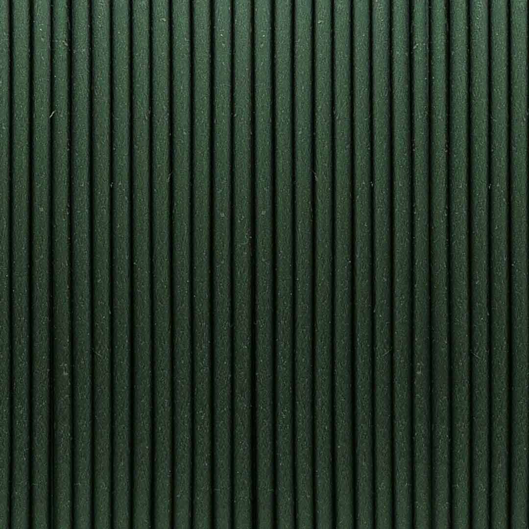 High-resolution macro shot of Emerald Green metallic PLA filament