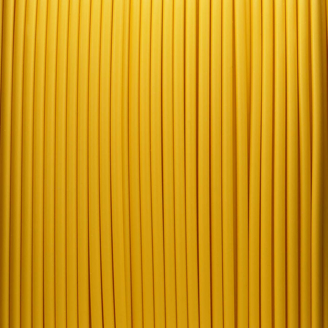 Macro texture view of Turmeric Yellow Pastel PLA 3D filament